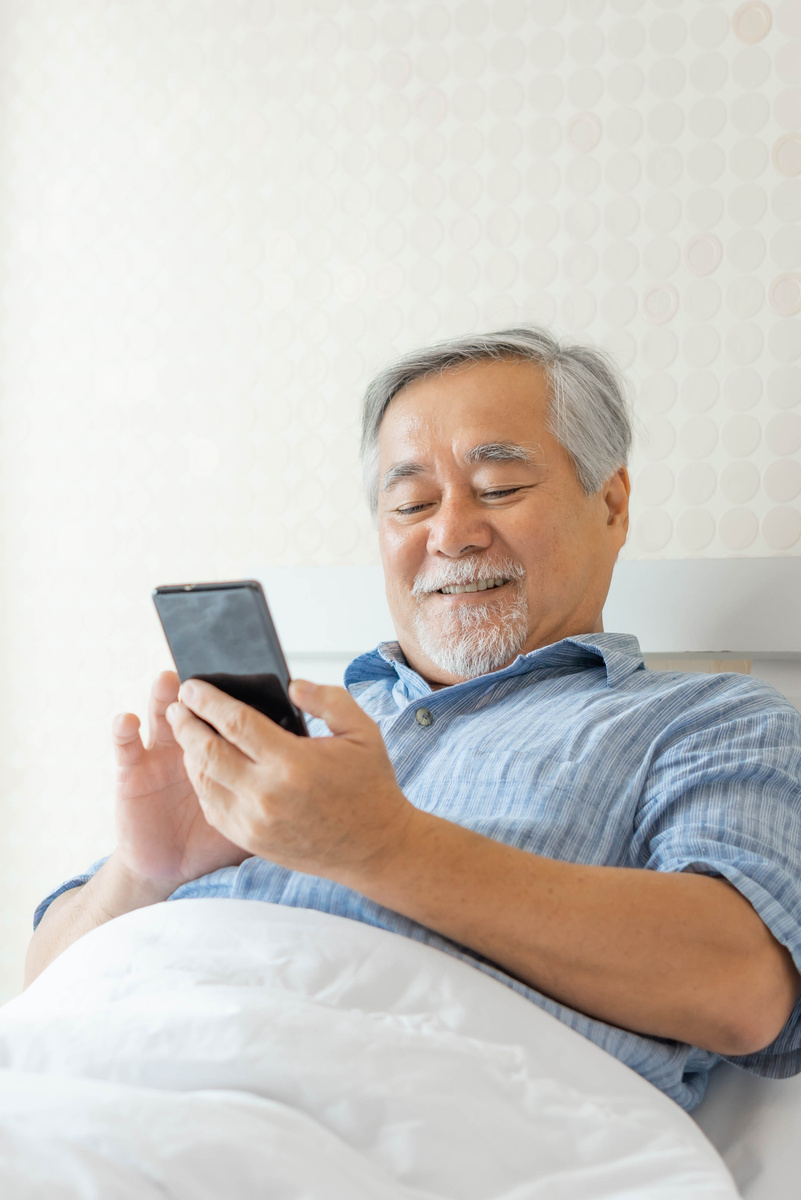 Elderly Man Using Smartphone